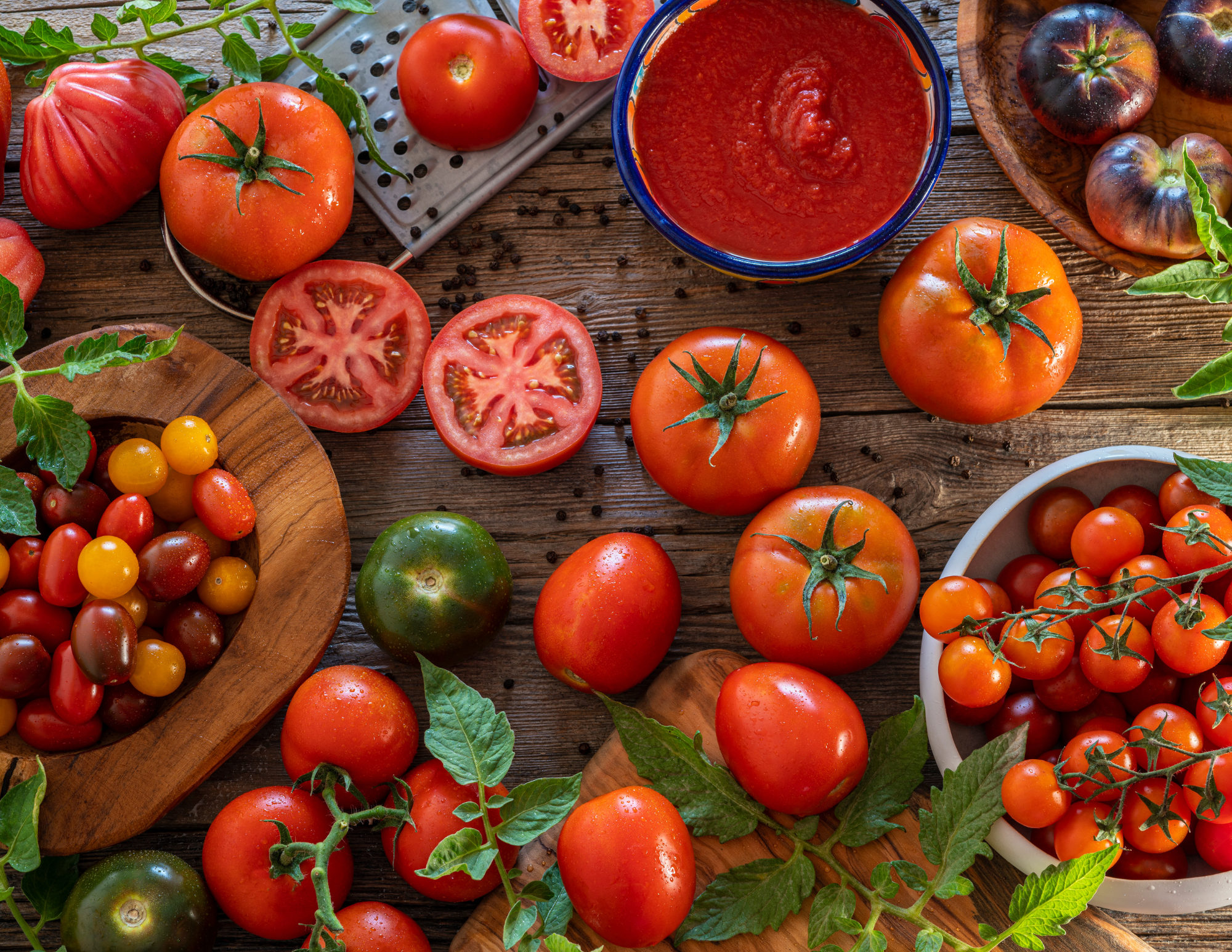 tomatoes on a board and in bowls